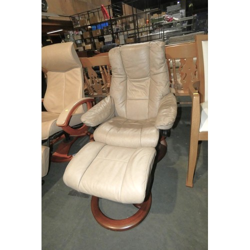 2220 - A Stressless cream upholstered reclining swivelling lounge chair with a matching foot stool