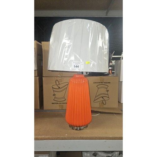 144 - 1 x orange glass table lamp with shade approx 69cm high