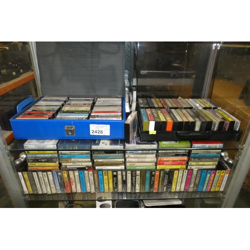 2428 - A large quantity of various cassette tapes, most Pre-recorded including, Bob Dylan, David Bowie, Van... 