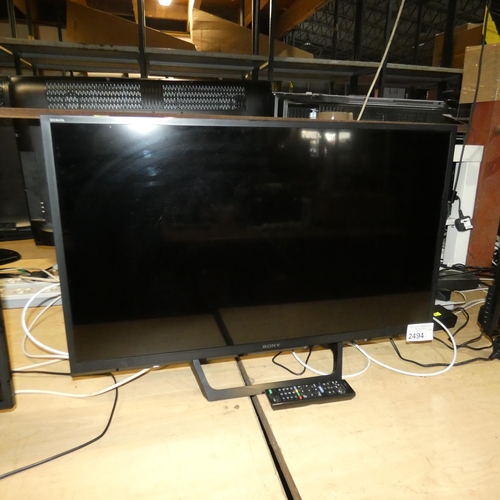 2494 - A 32 inch flatscreen TV by Sony Type KDL-32RE403, comes with remote control and stand - trade