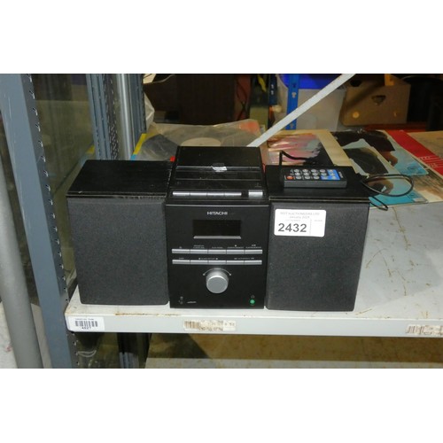 2432 - A compact stereo system by Hitachi with speakers and remote control - trade