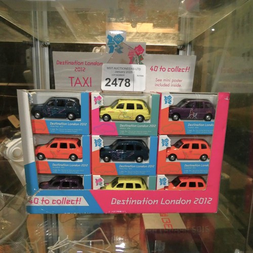 2478 - A box containing 36 Olympic 2012 London Taxi's by Corgi