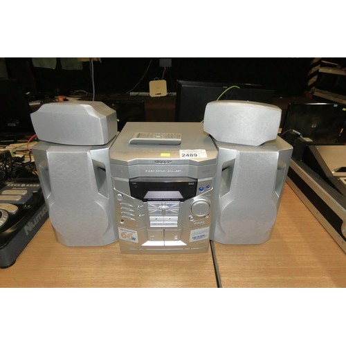 2489 - A stereo unit by Sharp with CD, twin cassette & 4 way speaker system - trade