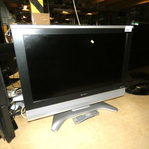 2498 - WITHDRAWN A 32 inch colour LCD TV by Sharp type Aquos LC-32GD8E comes with a stand and remote contro... 