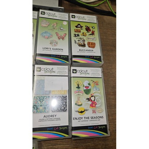 2509 - 13 various Cricut imagine art cartridges