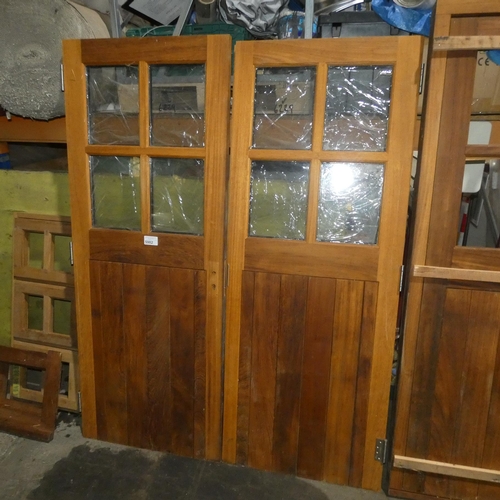 5982 - A pair of Iroko doors each fitted with 4 x panes of double glazed glass but no frame is included, th... 