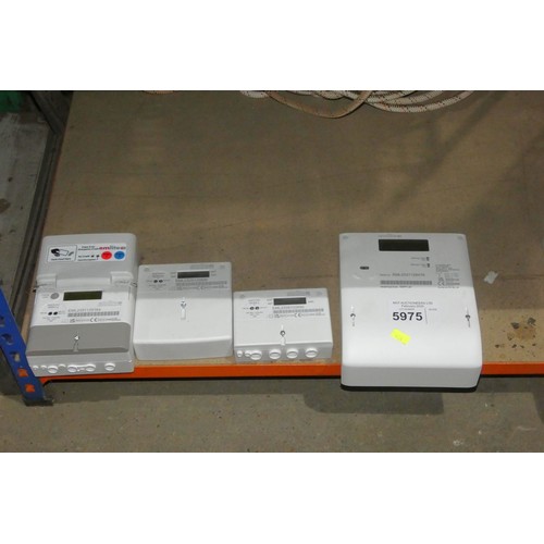 5975 - 4 x Emlite electric meters comprising 1 x Ema1.y, 1 x ECA2.nv, 1 x ECA2.z and 1 x EMP1.av