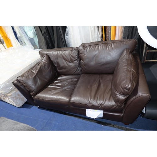 271 - A brown upholstered two seater sofa approx 185cm wide. Please note that this sofa is used