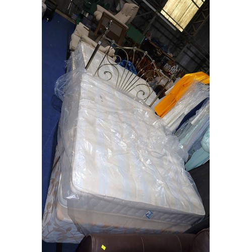 270 - A double bed with a two part divan base, a Royalty pocket sprung 4ft 6 inch mattress and a metal hea... 