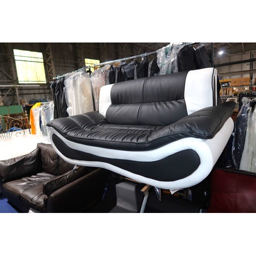 272 - A Napoli 2KA modern style black / white upholstered sofa approx 160cm wide (3 x foot cups are missin... 