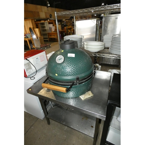 1213 - A commercial Big Green Egg Barbecue custom fitted into a stainless steel catering type table with sh... 