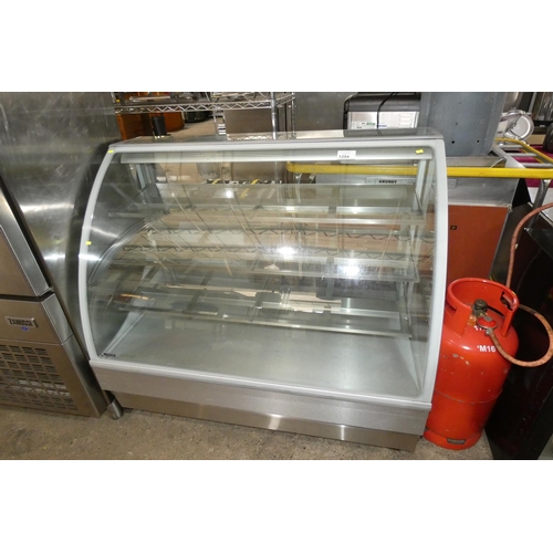 1294 - A curved front serve over ambient display cabinet by Norpe, this unit is not refrigerated but has th... 