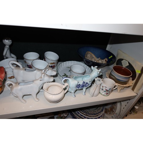 3038 - A quantity of miscellaneous decorative chinaware and ornaments etc (three shelves)
