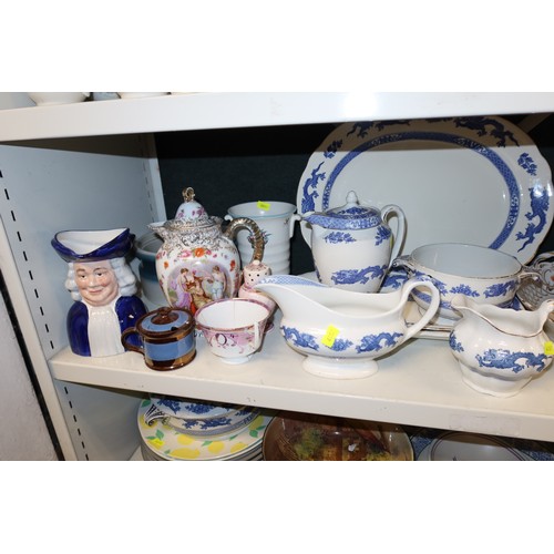 3040 - A quantity of miscellaneous decorative chinaware, glassware and ornaments etc (four shelves)