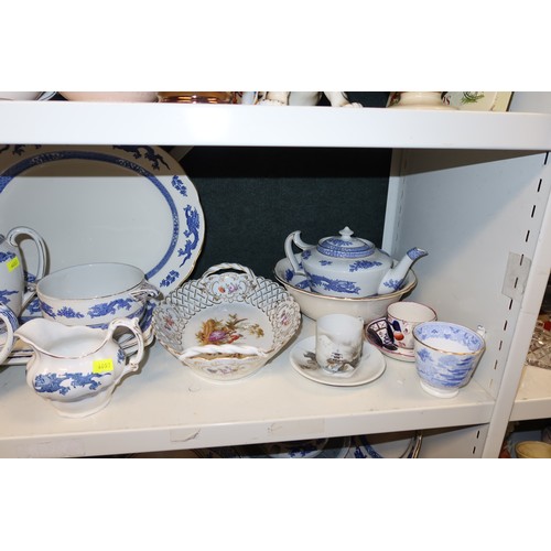 3040 - A quantity of miscellaneous decorative chinaware, glassware and ornaments etc (four shelves)