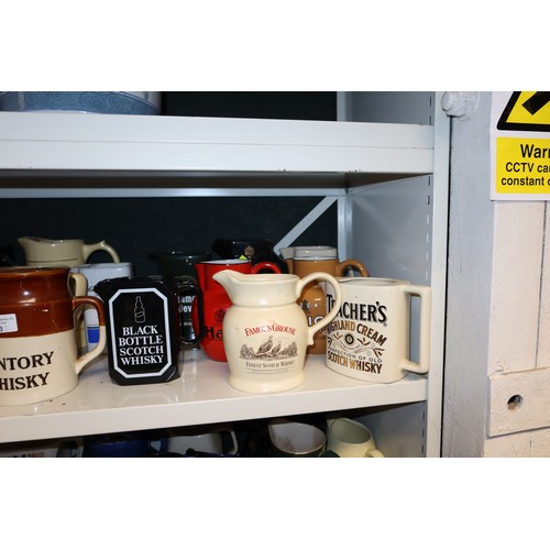 3043 - A quantity of miscellaneous decorative advertising whisky water jugs and other decorative glassware ... 