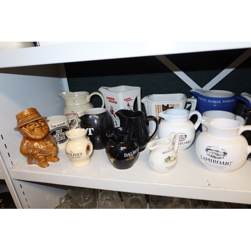 3043 - A quantity of miscellaneous decorative advertising whisky water jugs and other decorative glassware ... 