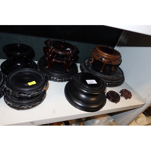 3051 - A collection of miscellaneous carved hardwood oriental and other stands (one shelf)