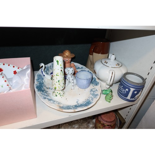 3057 - A quantity of miscellaneous decorative tea ware, glassware, ornaments and trinkets etc (three shelve... 