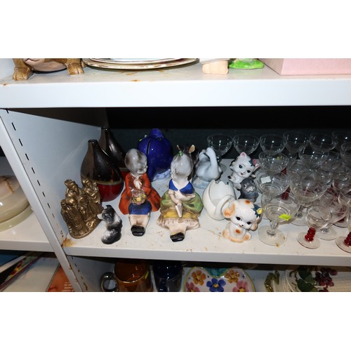 3057 - A quantity of miscellaneous decorative tea ware, glassware, ornaments and trinkets etc (three shelve... 