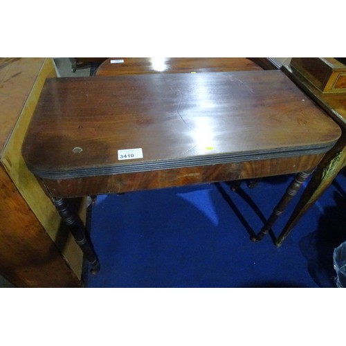 3410 - A 19th Century mahogany rectangular topped fold over tea table on turned legs