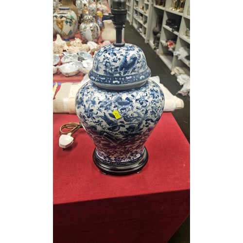 3012 - A pair of large blue and white oriental style floral decorated table lamps with shades