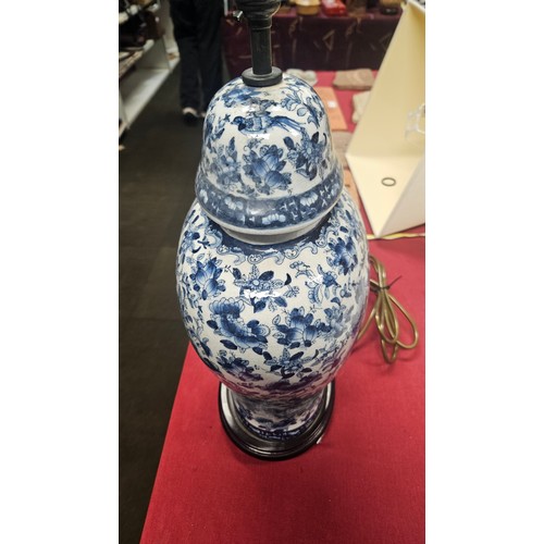 3012 - A pair of large blue and white oriental style floral decorated table lamps with shades