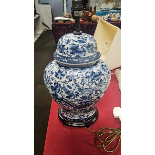 3012 - A pair of large blue and white oriental style floral decorated table lamps with shades
