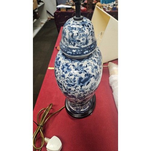3012 - A pair of large blue and white oriental style floral decorated table lamps with shades