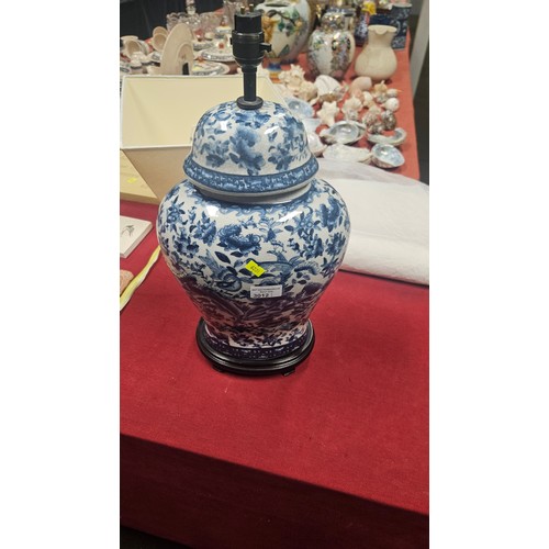 3012 - A pair of large blue and white oriental style floral decorated table lamps with shades