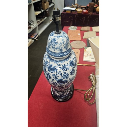 3012 - A pair of large blue and white oriental style floral decorated table lamps with shades