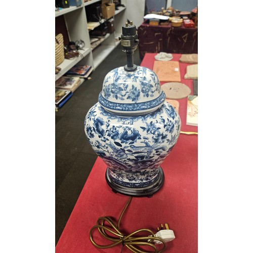 3012 - A pair of large blue and white oriental style floral decorated table lamps with shades
