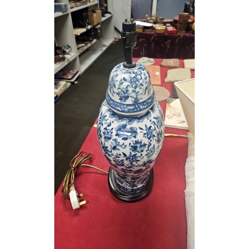 3012 - A pair of large blue and white oriental style floral decorated table lamps with shades
