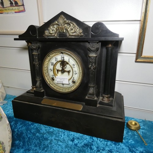 An Edwardian heavy slate temple style mantle clock