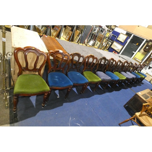 4363 - A set of 12 Victorian mahogany shaped back dining chairs with upholstered seats on fluted and tapere... 