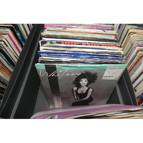 A large quantity of various 7 inch vinyl records. Contents of 1 shelf