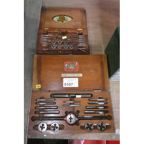 5107 - 2 x wooden boxes containing a quantity of taps and dies