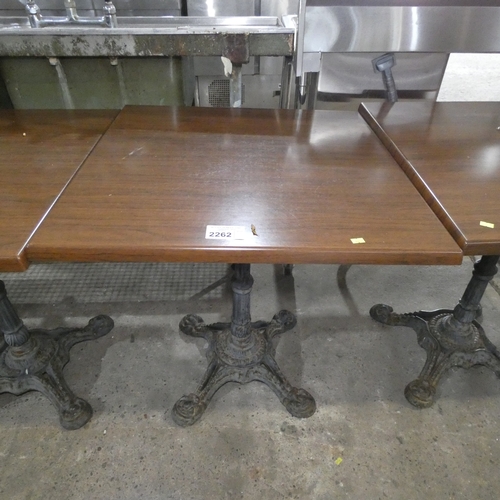 2262 - A square wood effect pub / Cafe type table with decorative cast iron base approx 70*70*77cm