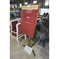 A notice board with a box of compatible letters and a notice board stand