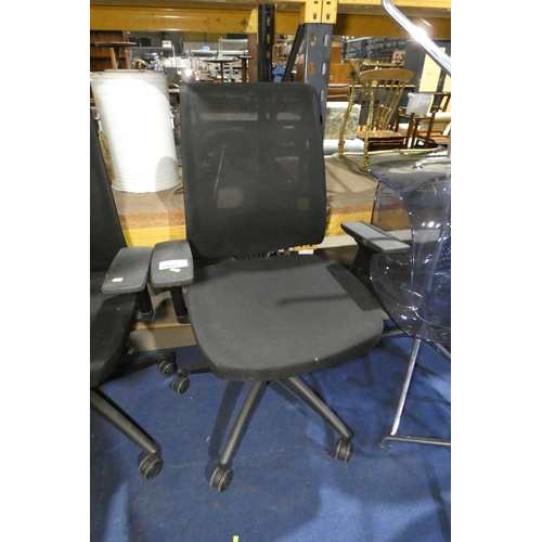 2428 - A black upholstered office swivel chair with mesh back by Haiken