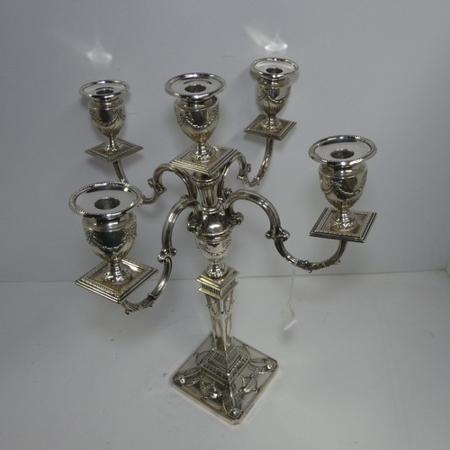 4156 - An Elizabeth 2nd very ornate embossed silver five branch candelabra with a square tapered column & s... 