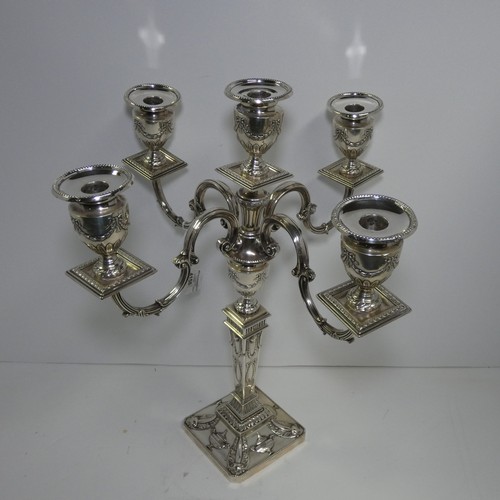 4156 - An Elizabeth 2nd very ornate embossed silver five branch candelabra with a square tapered column & s... 