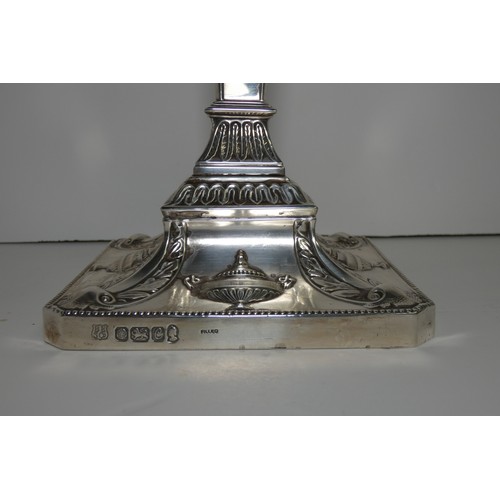 4156 - An Elizabeth 2nd very ornate embossed silver five branch candelabra with a square tapered column & s... 