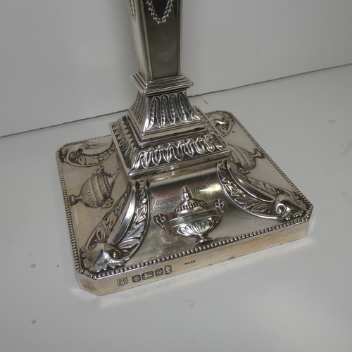 4156 - An Elizabeth 2nd very ornate embossed silver five branch candelabra with a square tapered column & s... 