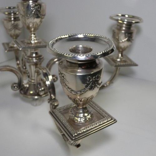 4156 - An Elizabeth 2nd very ornate embossed silver five branch candelabra with a square tapered column & s... 