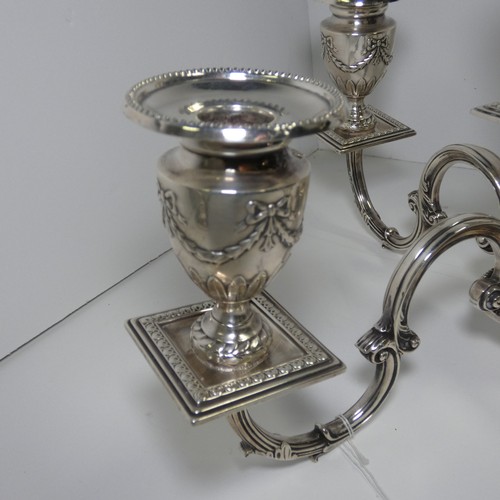 4156 - An Elizabeth 2nd very ornate embossed silver five branch candelabra with a square tapered column & s... 