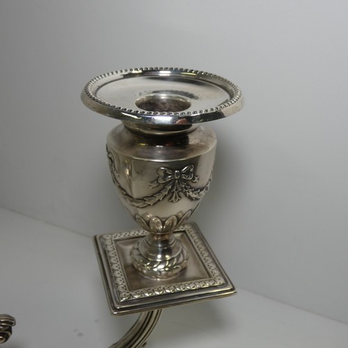 4156 - An Elizabeth 2nd very ornate embossed silver five branch candelabra with a square tapered column & s... 