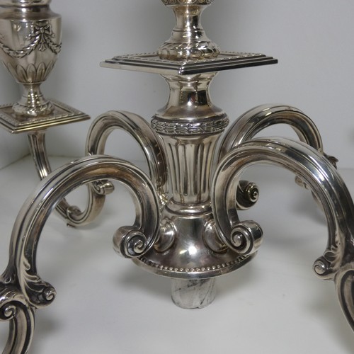 4156 - An Elizabeth 2nd very ornate embossed silver five branch candelabra with a square tapered column & s... 