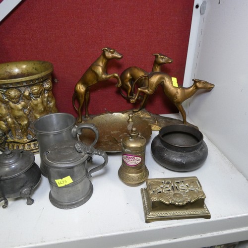 4020 - A circular brass plate, a vintage copper kettle, a pair of brass candlesticks and a quantity of misc... 