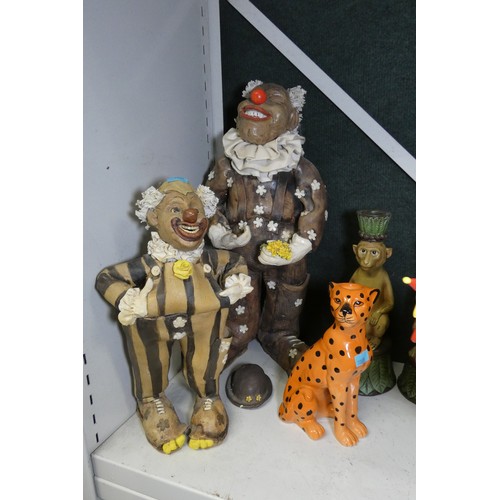 4032 - A quantity of various very colourful figures, candlesticks and other ornaments etc (one shelf)